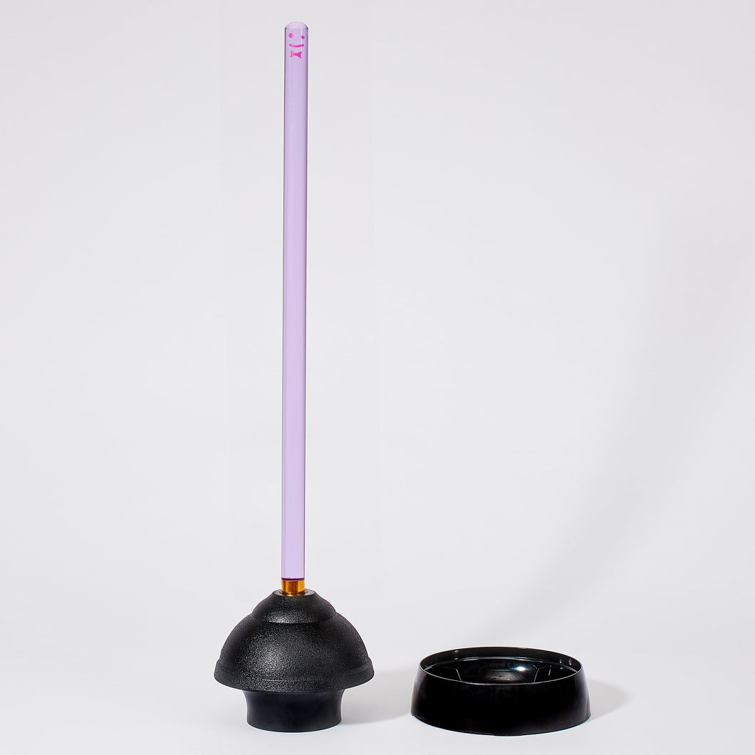 Image of a purple handle plunger with black rubber base set outdie of its black holding base on a white background.
