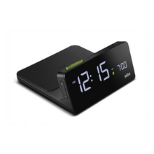 Load image into Gallery viewer, 3/4 view of black digital clock against a white background. The charging dock is attached behind the clock. The clock face is black and can be illuminated.
