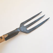 Load image into Gallery viewer, Closeup view of a handheld garden fork in metal with a wooden handle.
