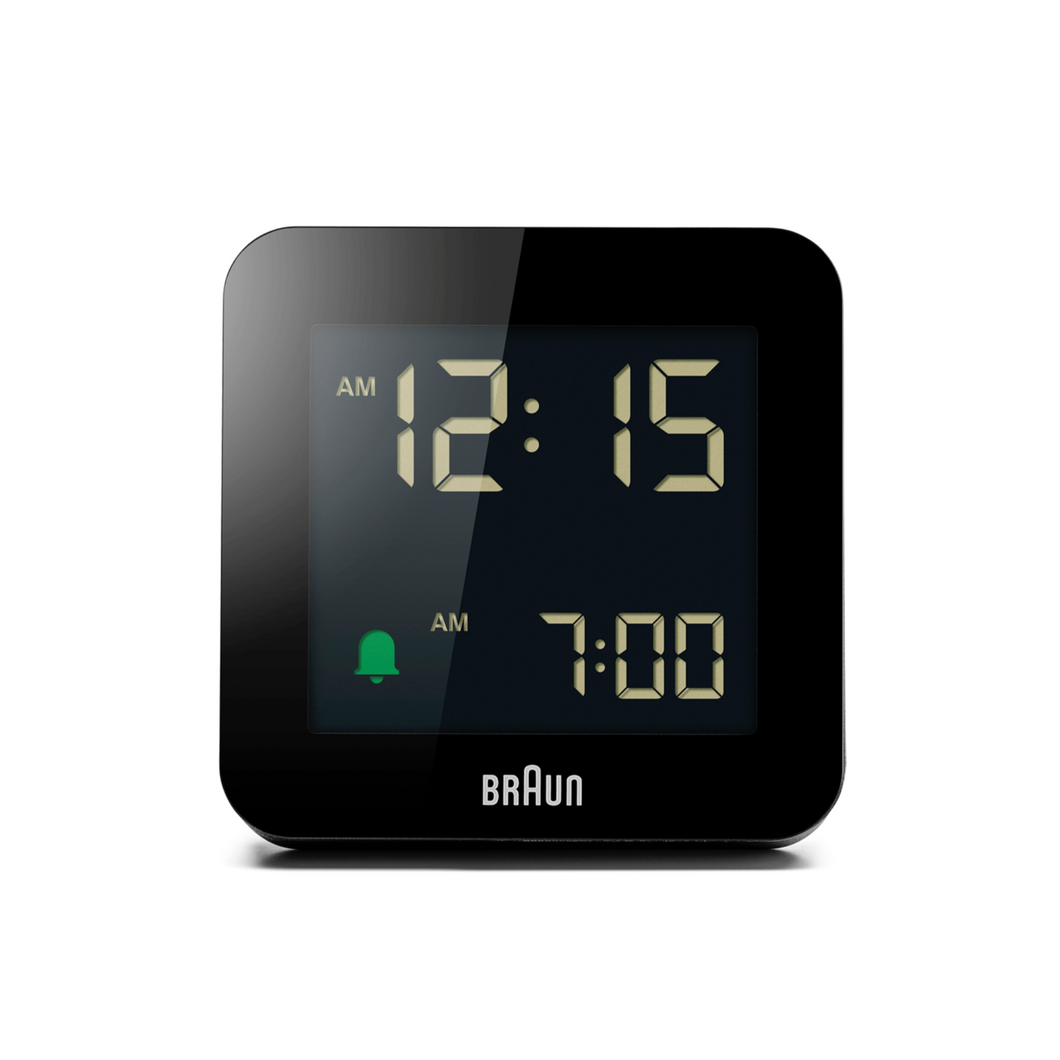 Frontal view of square black digital clock against a white background. The clock face is black and has illuminated numbers.