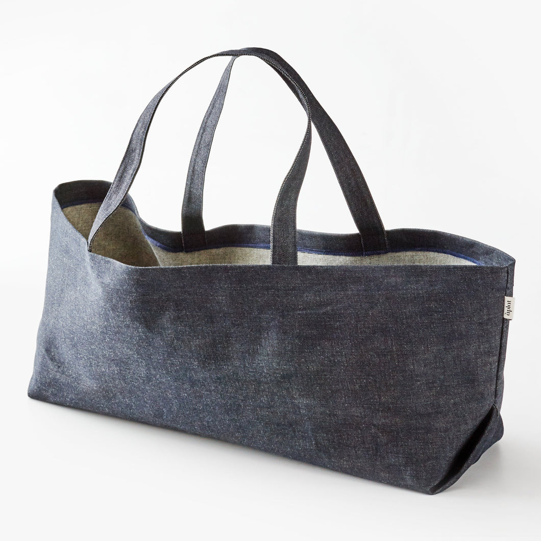 Extra wide denim tote with two shoulder straps against a white background.