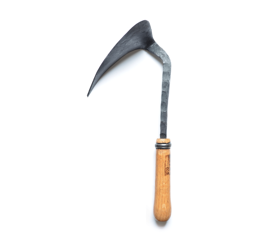 Side view of a rough hewn, hand-hammered metal hook shaped blade with a wooden handle.