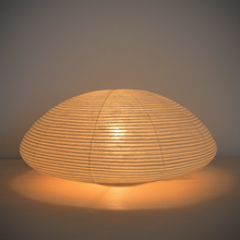 Load image into Gallery viewer, An illuminated simple LED low dome-shaped paper lantern.
