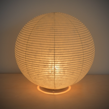 Load image into Gallery viewer, View of an illuminated simple ball-shaped LED paper lantern.
