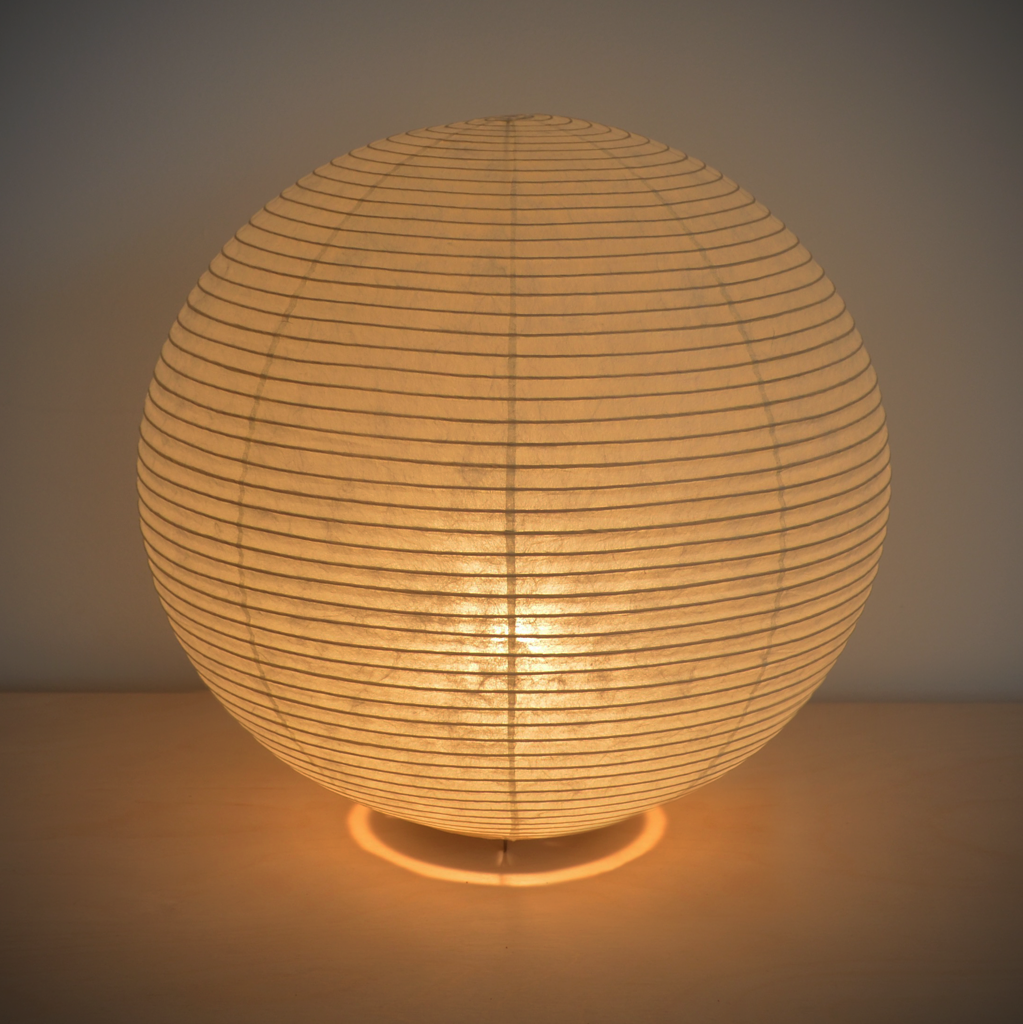 View of an illuminated simple ball-shaped LED paper lantern.