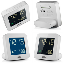 Load image into Gallery viewer, 4 angled views of square white digital clock against a white background. The clock face is black and has illuminated numbers. The profile is slim with a battery compartment acting as a stand.
