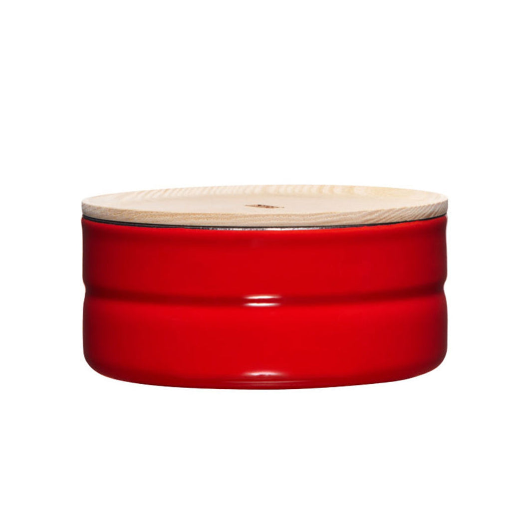 Straight on view of a red container with a wood top.